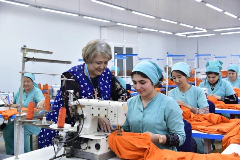 Women working at sewing machines in a garment factory