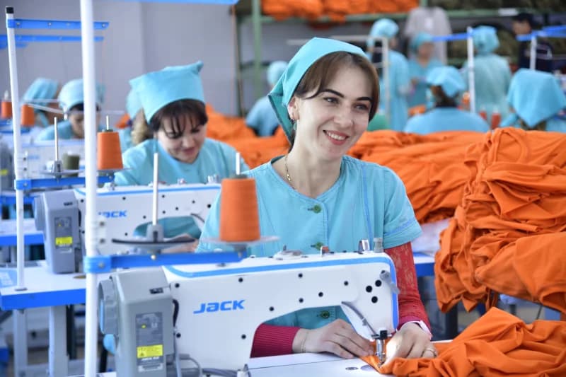 Women working at sewing machines in a garment factory