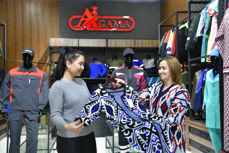 People examining clothing inside a store