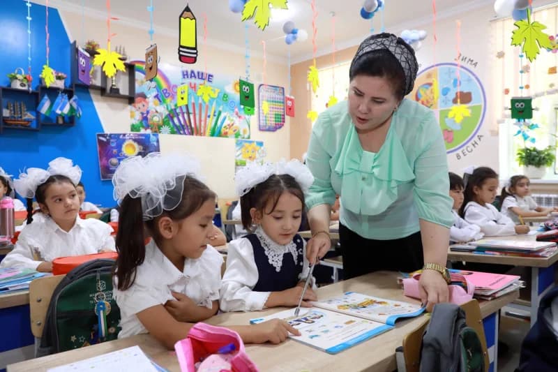 Teacher working with students in a classroom