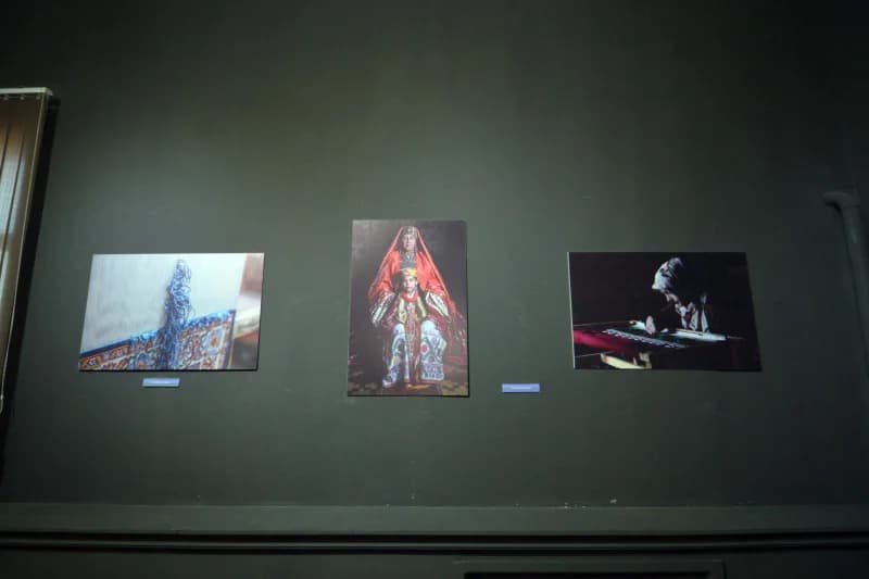 Photographs displayed on a wall