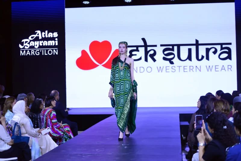 Model walking on runway during fashion show