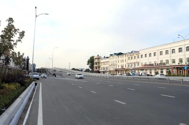 Vehicles driving on an asphalt road in a city
