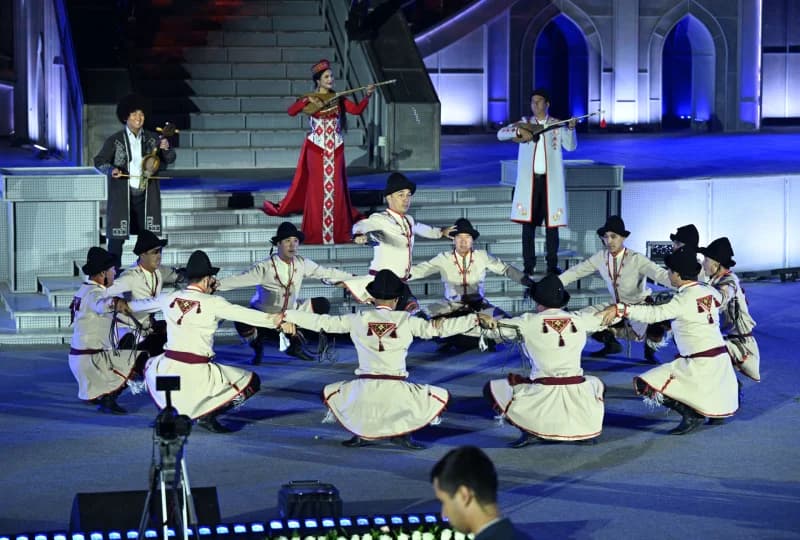 Performers in traditional clothing on stage
