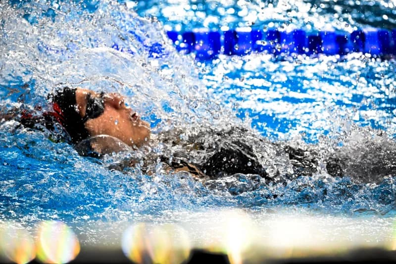 Swimmer competing in a pool