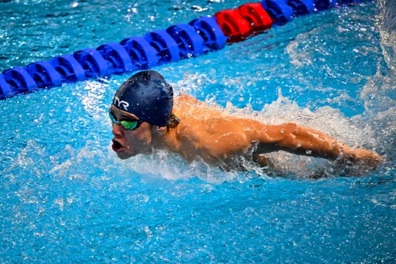 Swimmer competes in a swimming pool