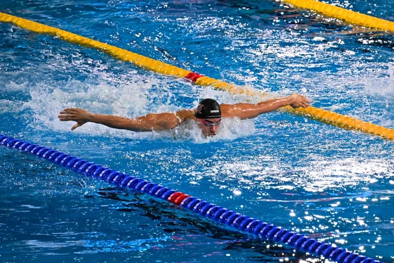 Swimmer competing in a pool