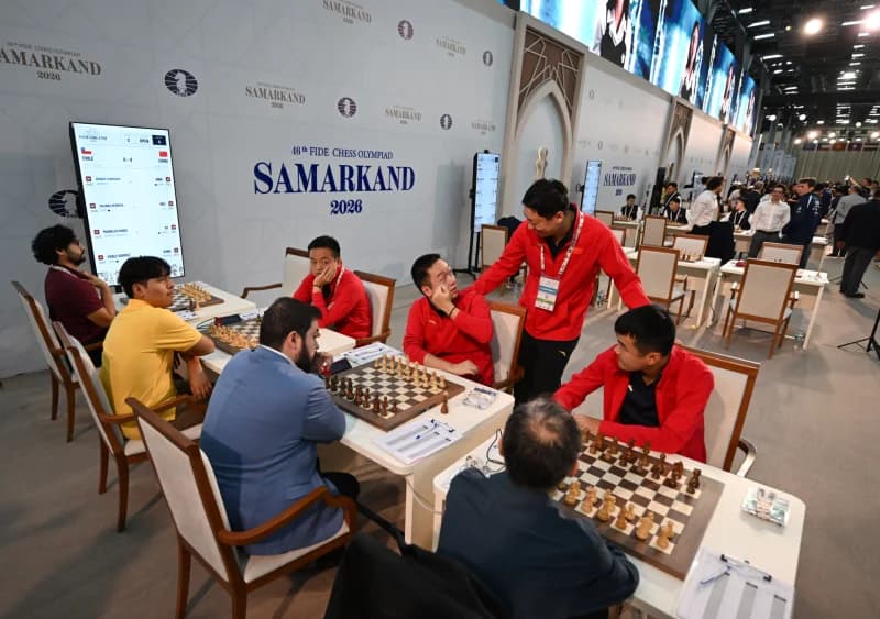 People playing chess at a competition hall
