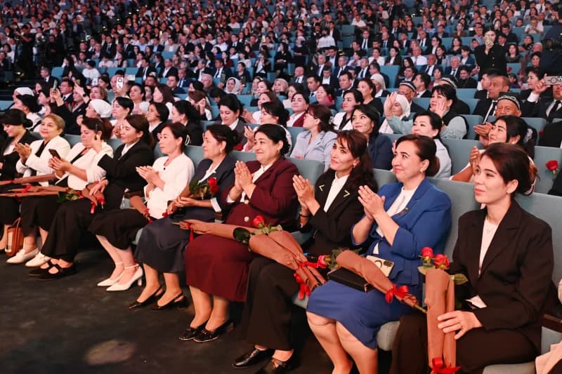People gathered in a large auditorium