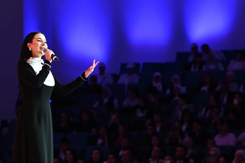 Woman singing on stage