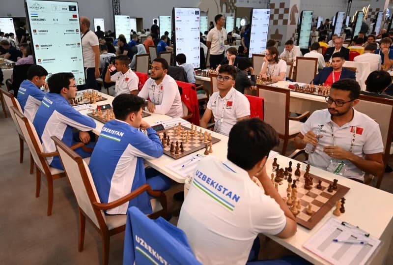Players compete at tables during a chess tournament