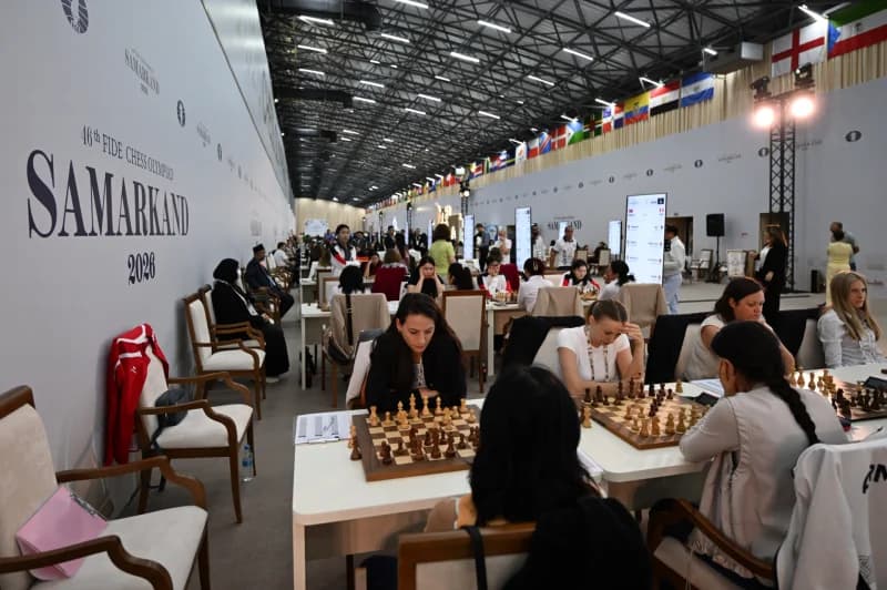People playing chess during an indoor tournament