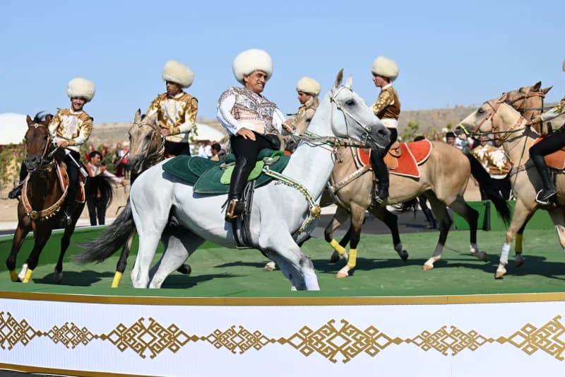 Men in traditional clothing riding horses during outdoor performance