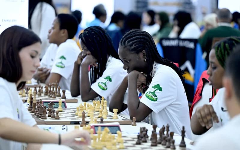 People playing chess at tables
