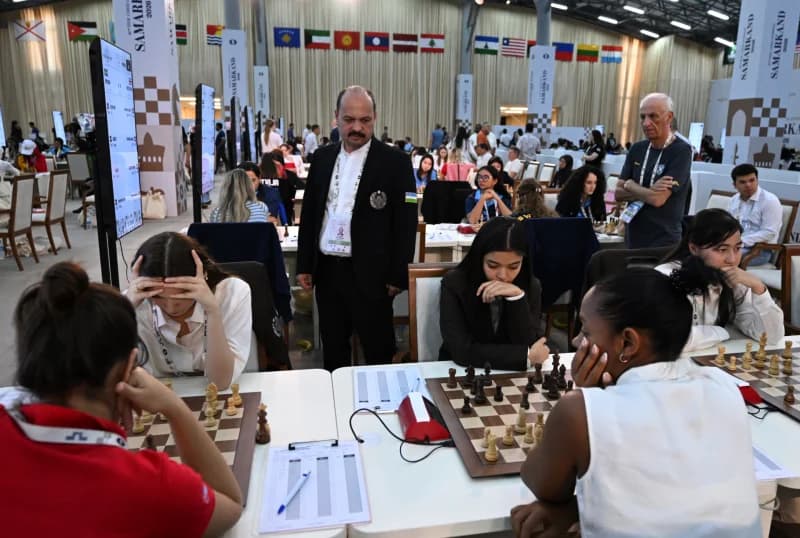 Chess competition hall with players at tables