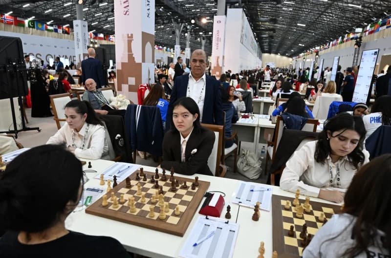 People playing chess at a competition hall