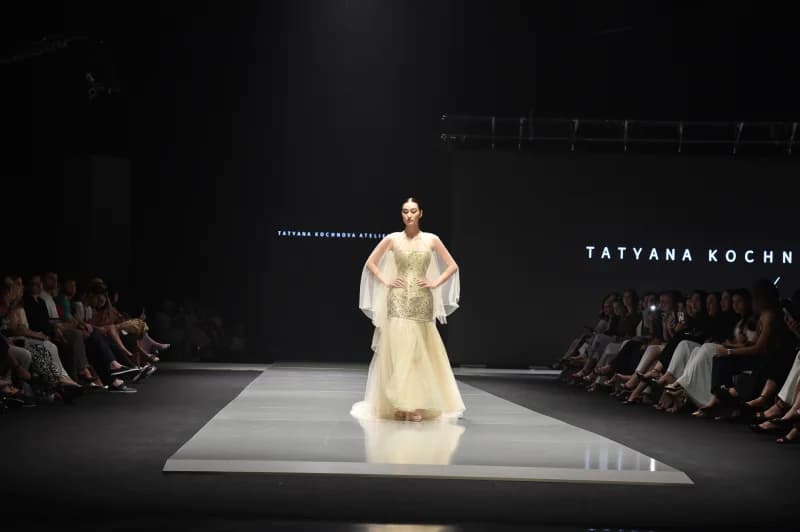Model walking down a fashion show runway