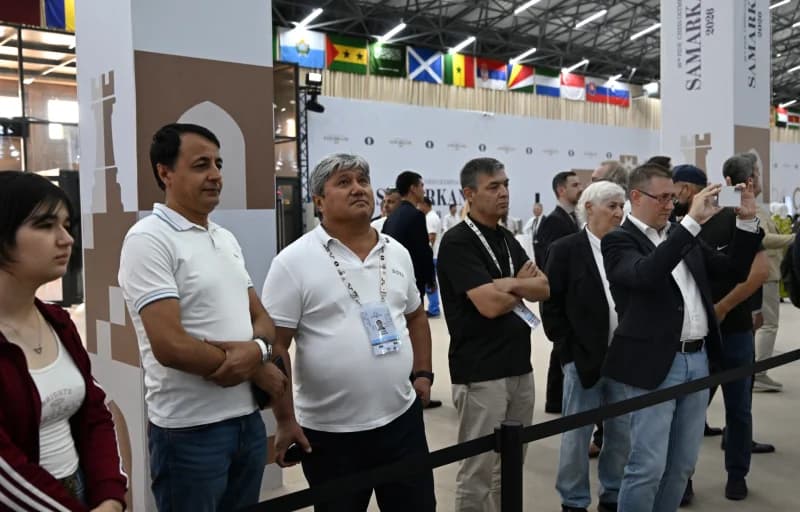 People gathered at indoor event with flags