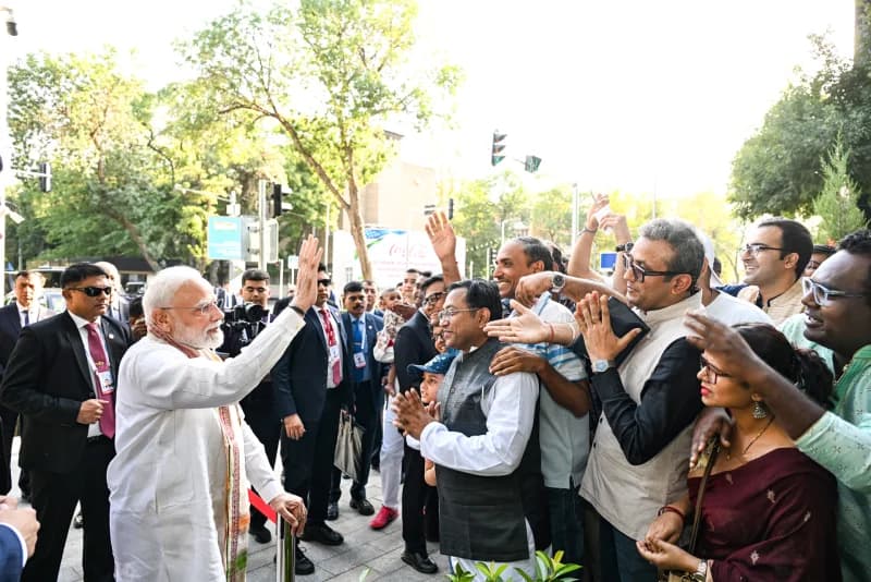 People greeting a leader on a city street