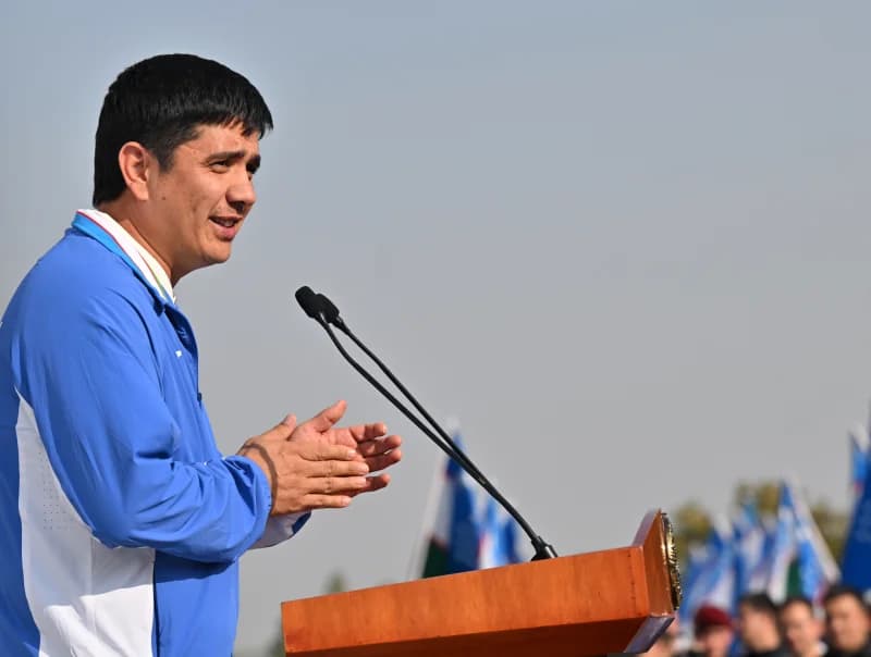 Person speaking at podium outdoors