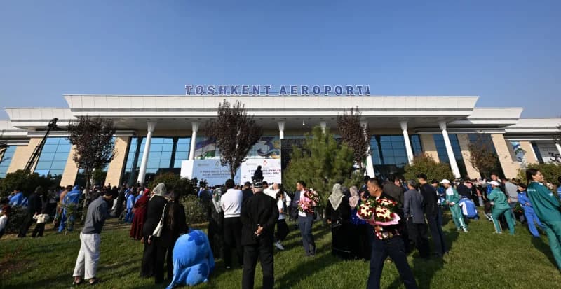 Crowd gathered outside an airport building