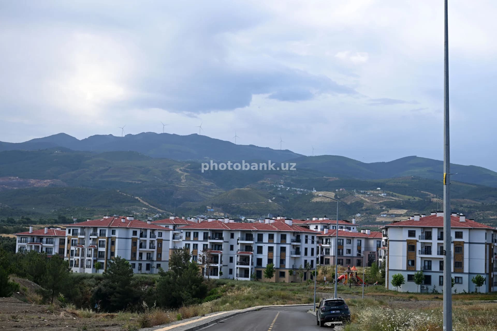 Modern residential complex near mountain range