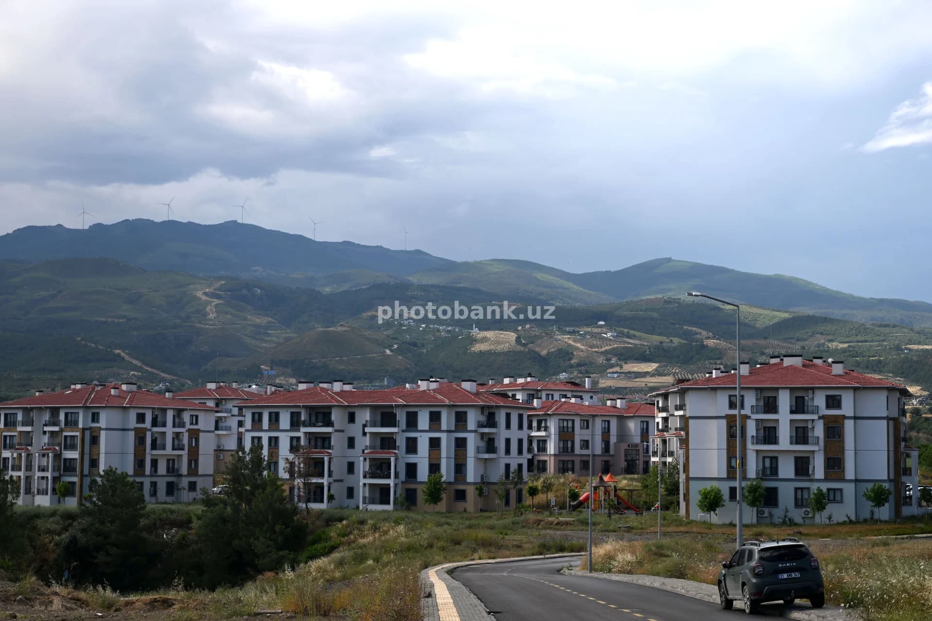 Modern residential complex near mountain range