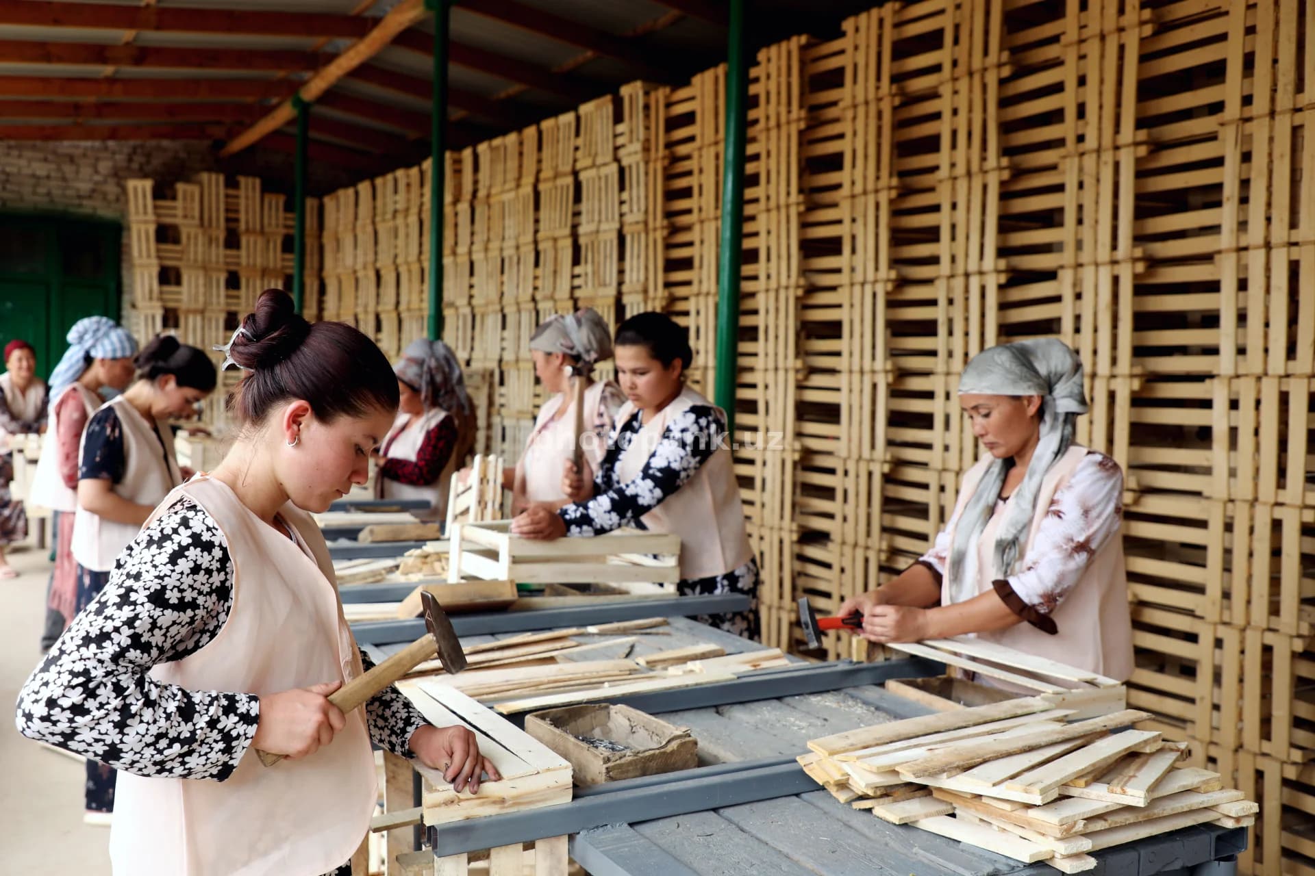 Women assembling wooden fruit crates