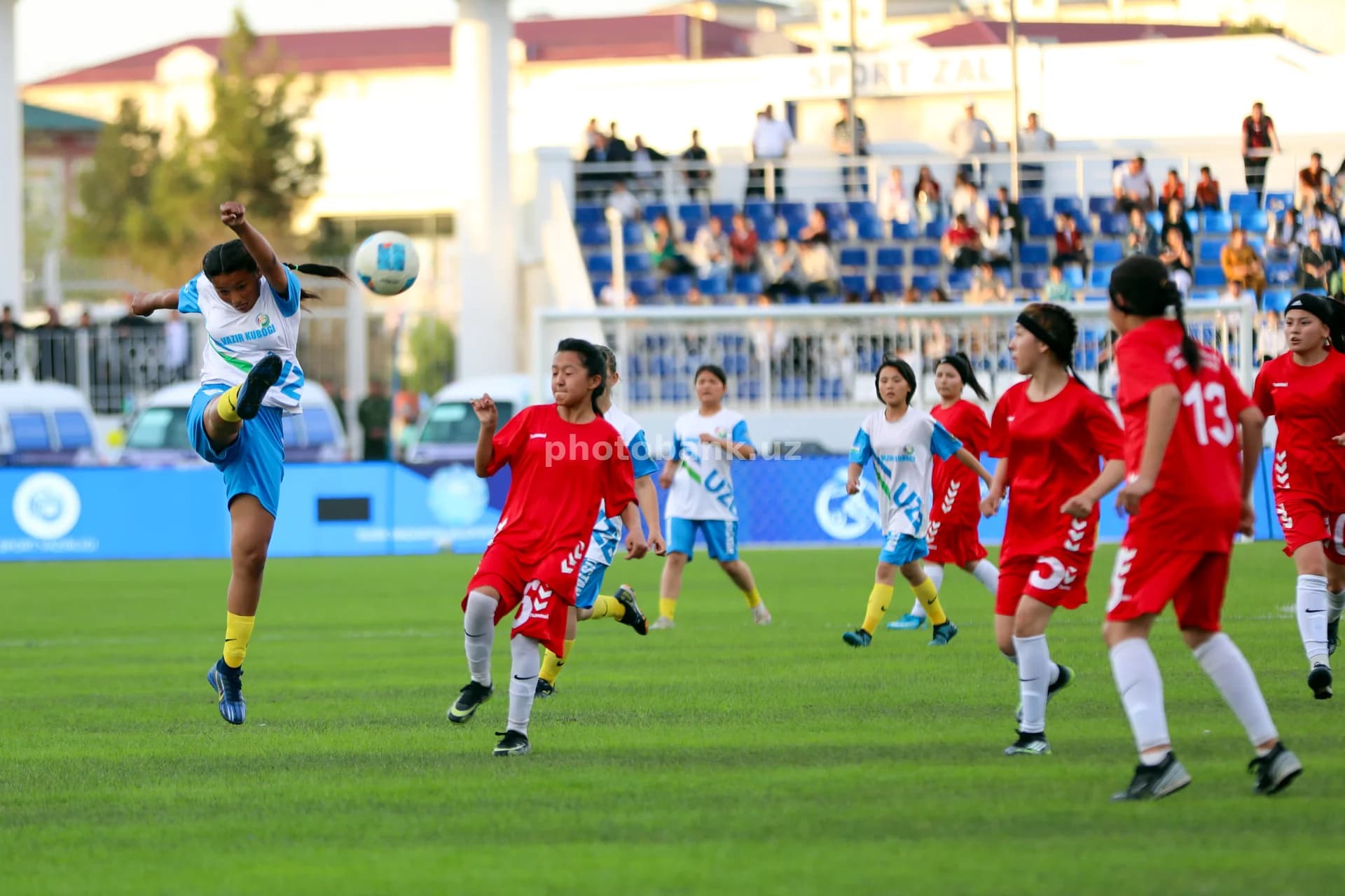 young female athletes playing football
