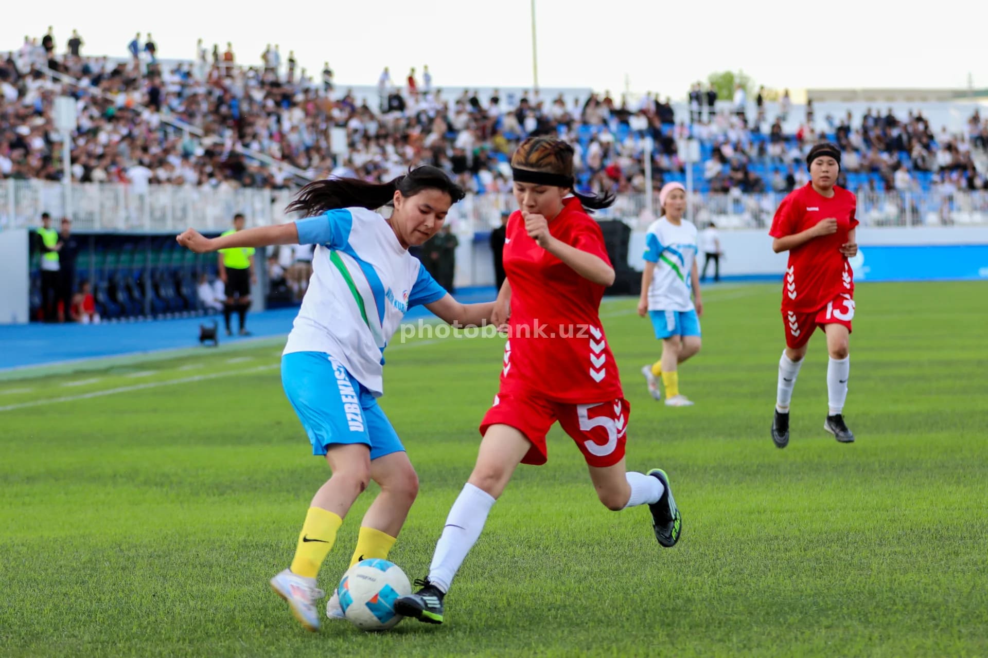 Female athletes compete for ball