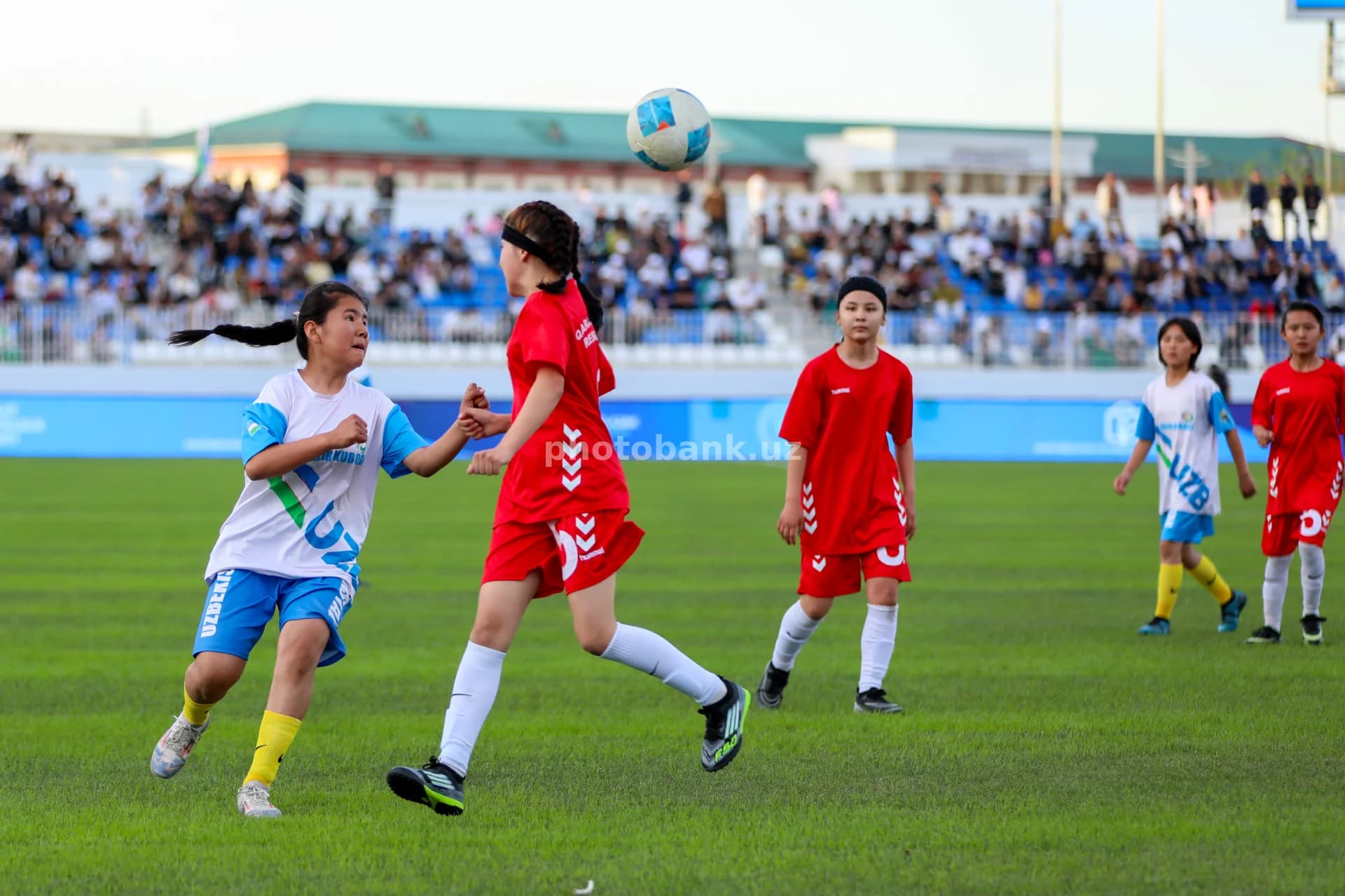 Young girls playing football match