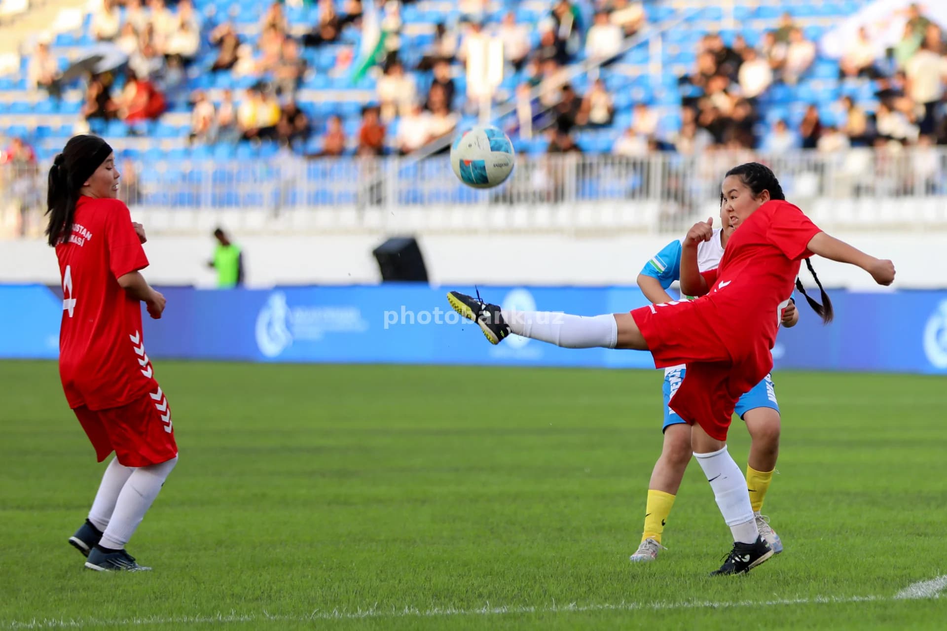 Female athletes playing football match