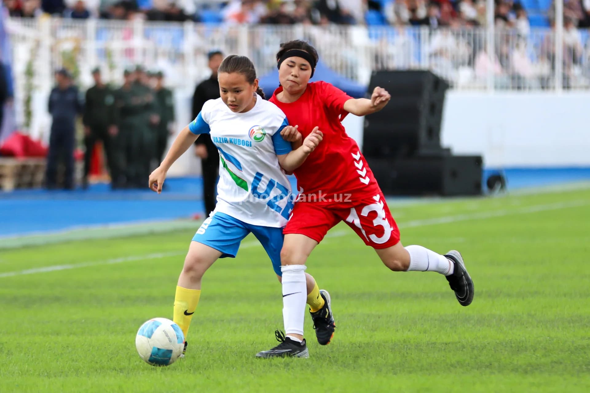 Young female athletes playing football