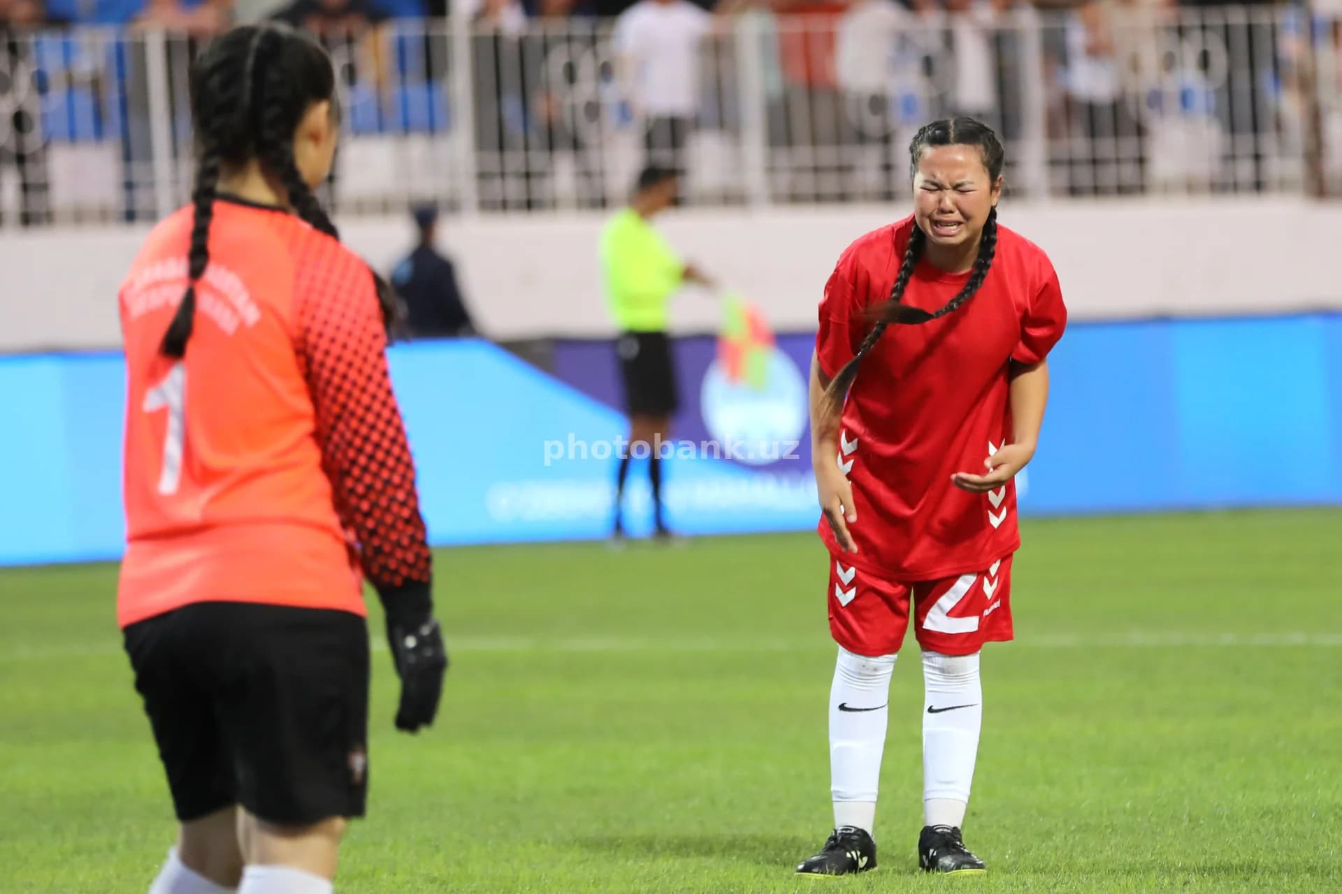 Female athlete crying on field