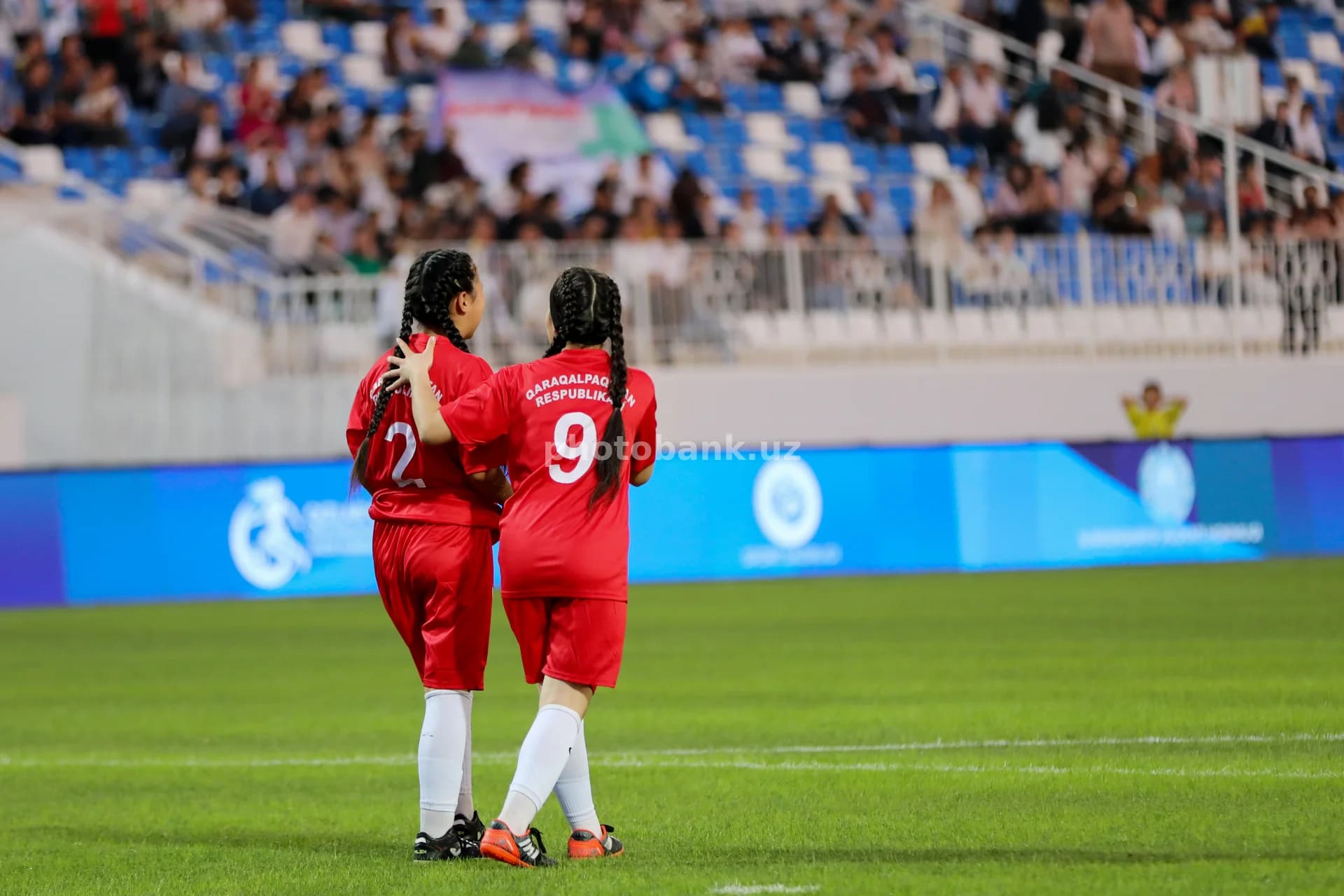 Young female athletes walking together