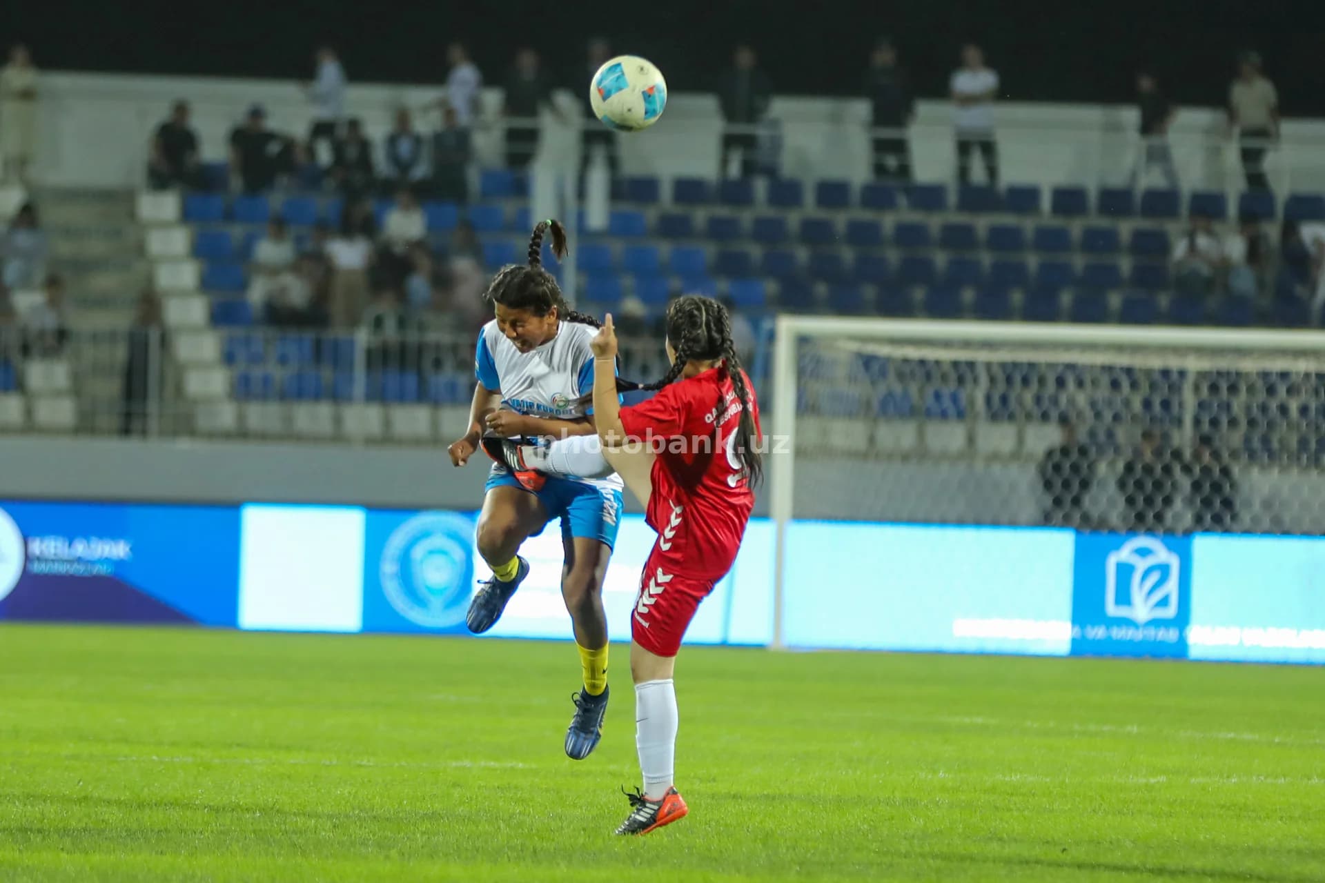 Female athletes competing for ball
