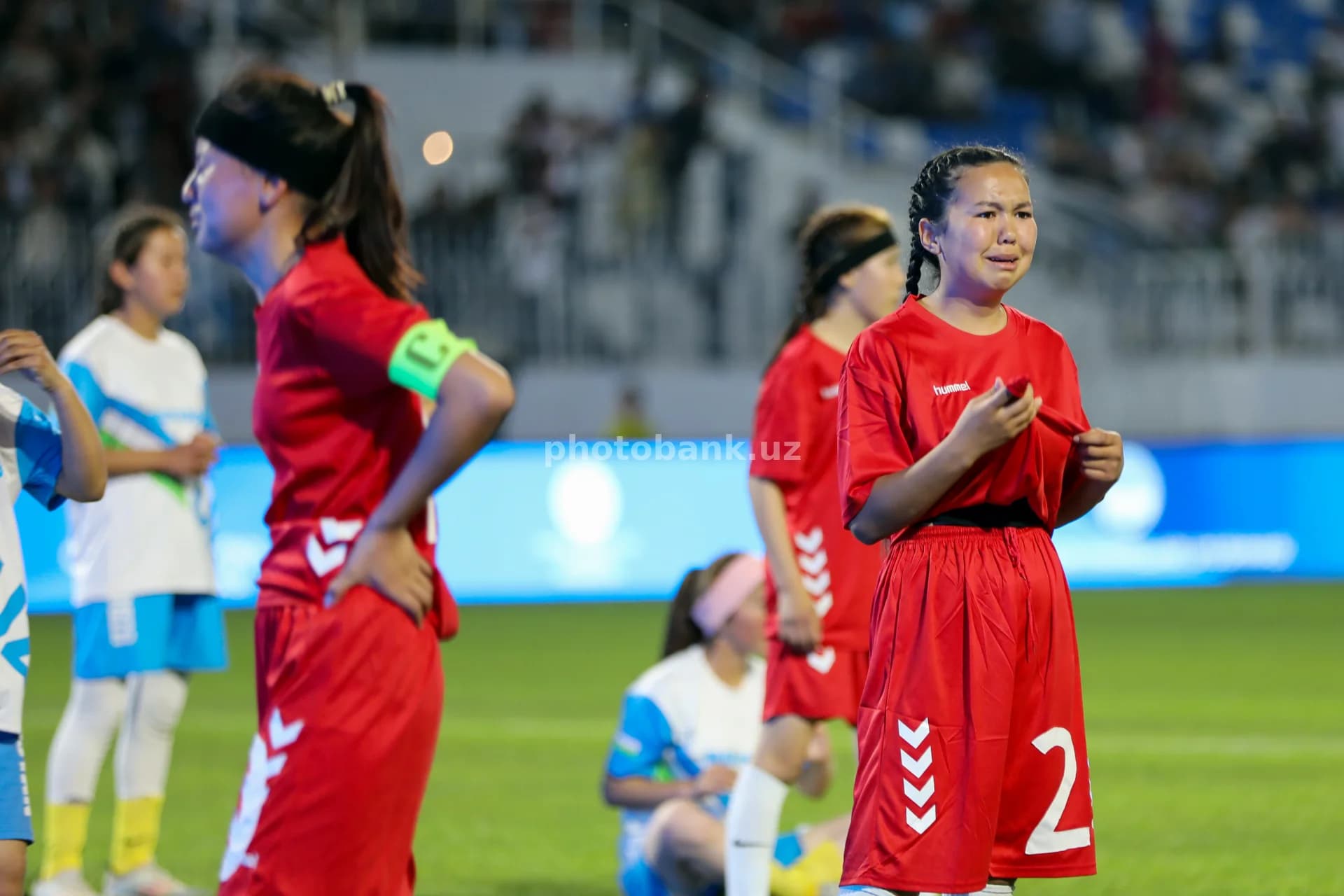 Young female athlete cries outdoors