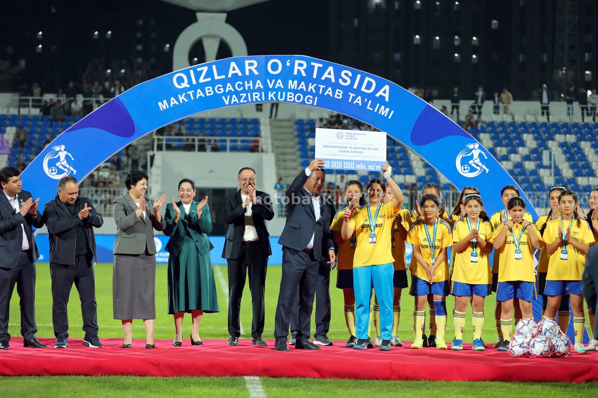 Officials award young female footballers