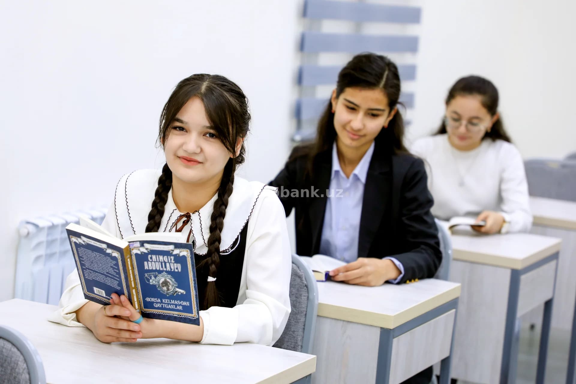 Students reading books in classroom
