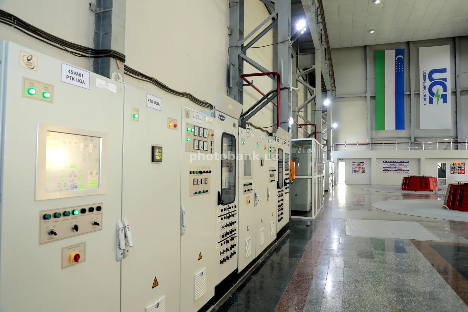 Technicians monitor industrial power control panels
