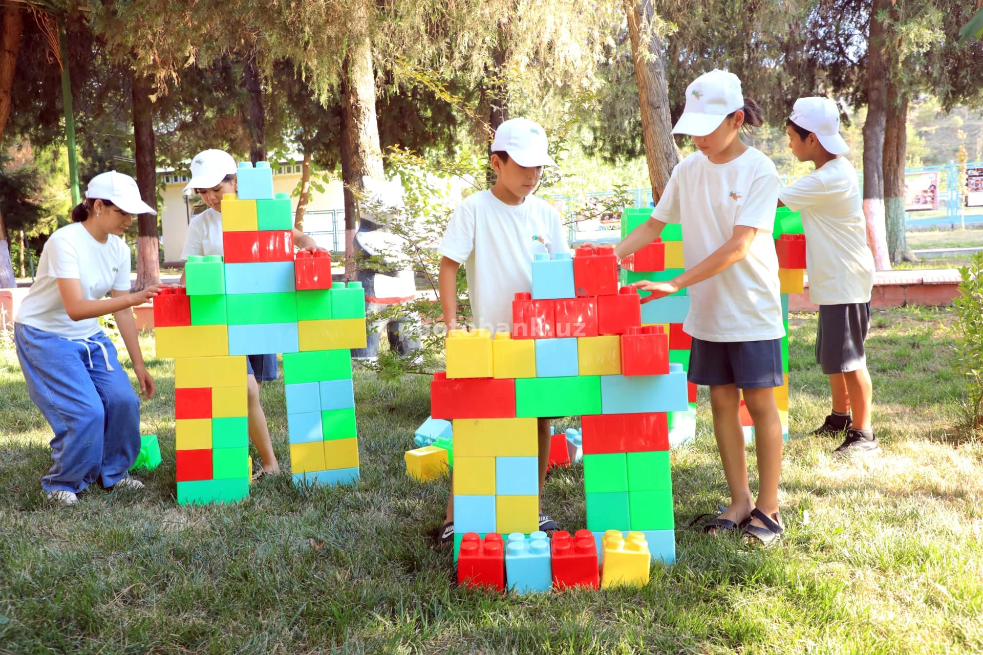 Children build structures with blocks