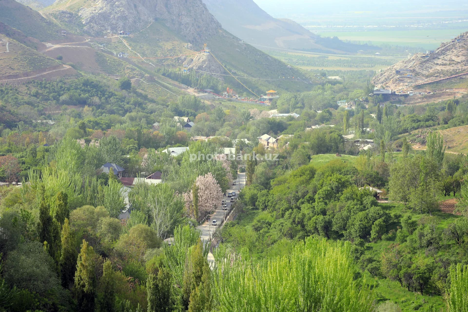Cars travel through mountain valley