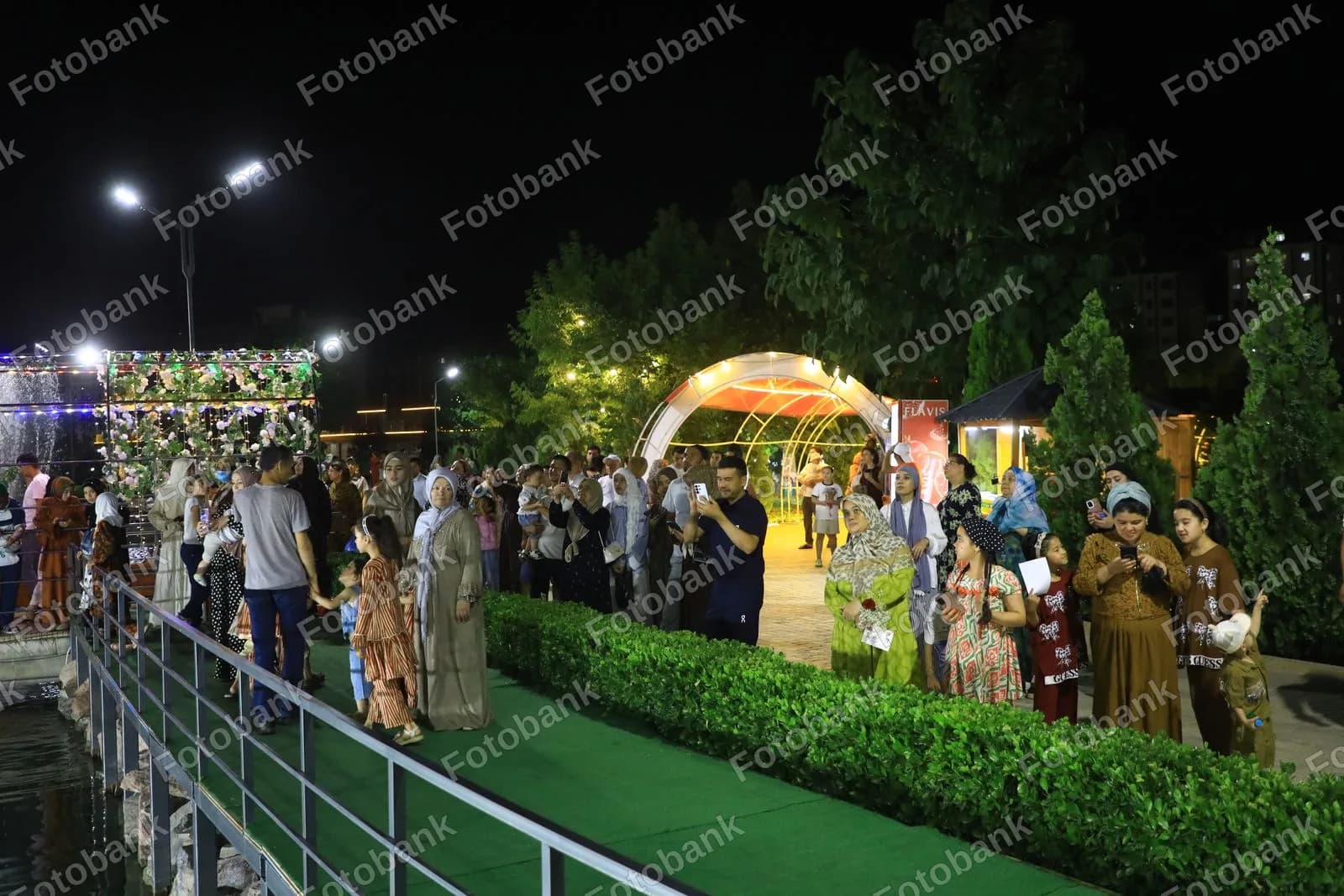 Families enjoy evening park walk