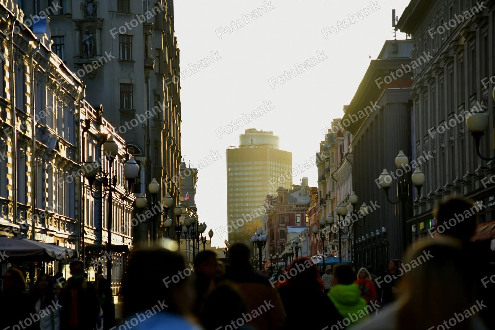 People walk along city street