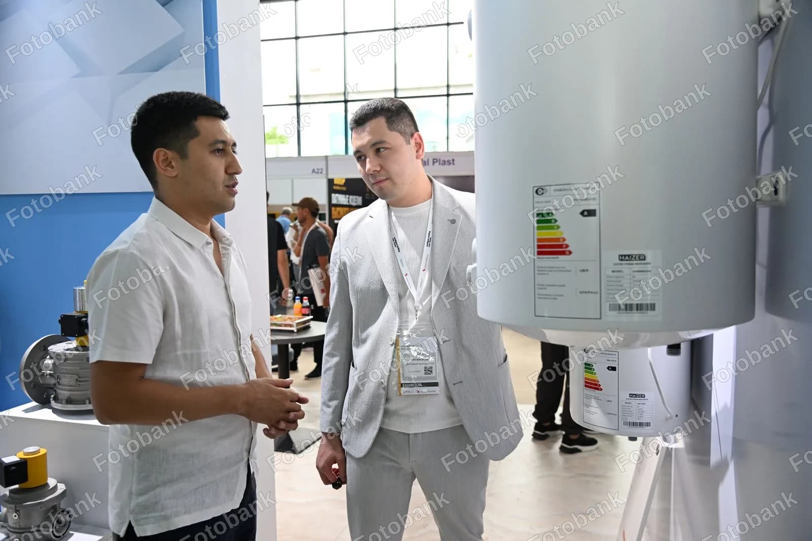 Men discussing industrial water heater