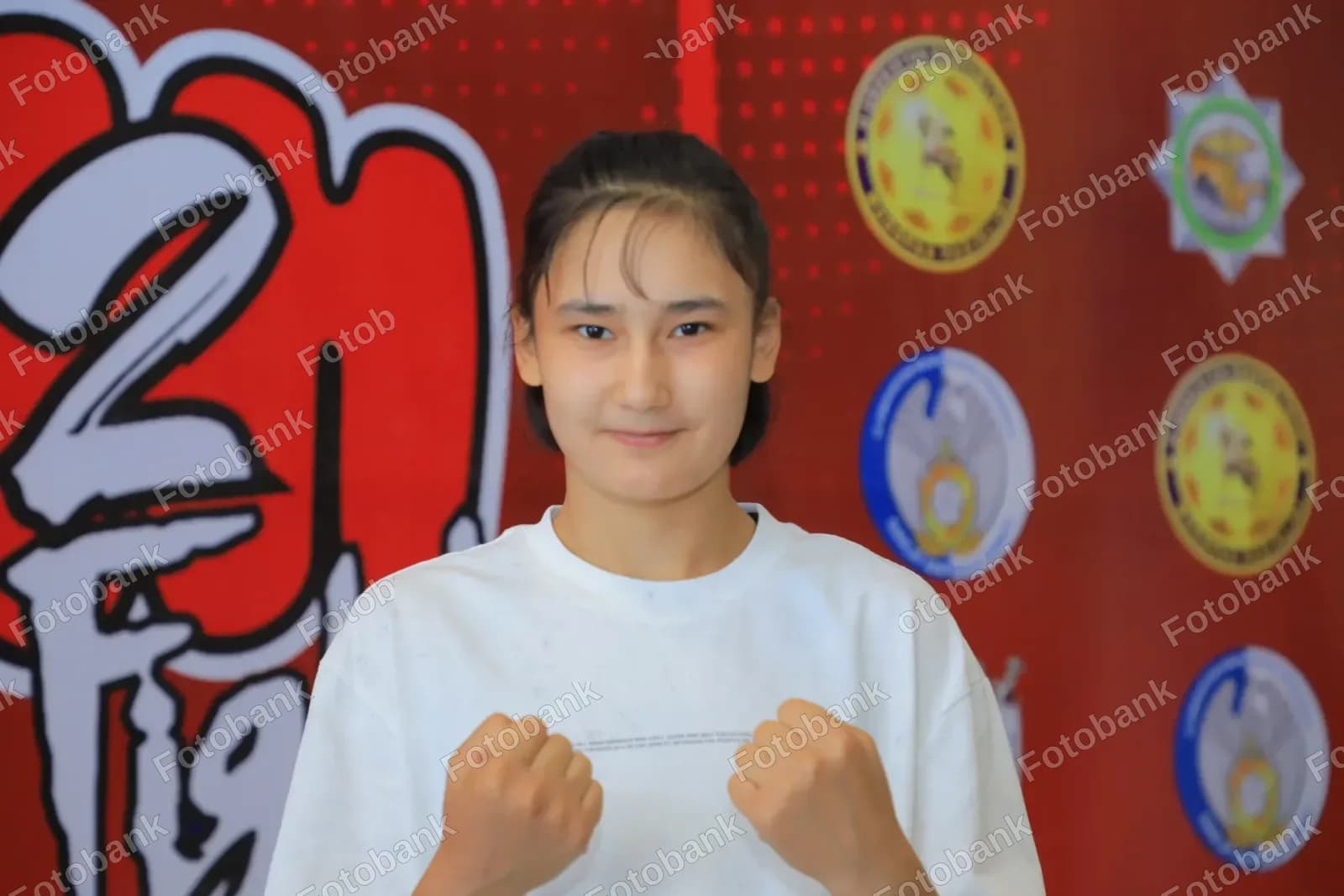 Young athlete posing with fists
