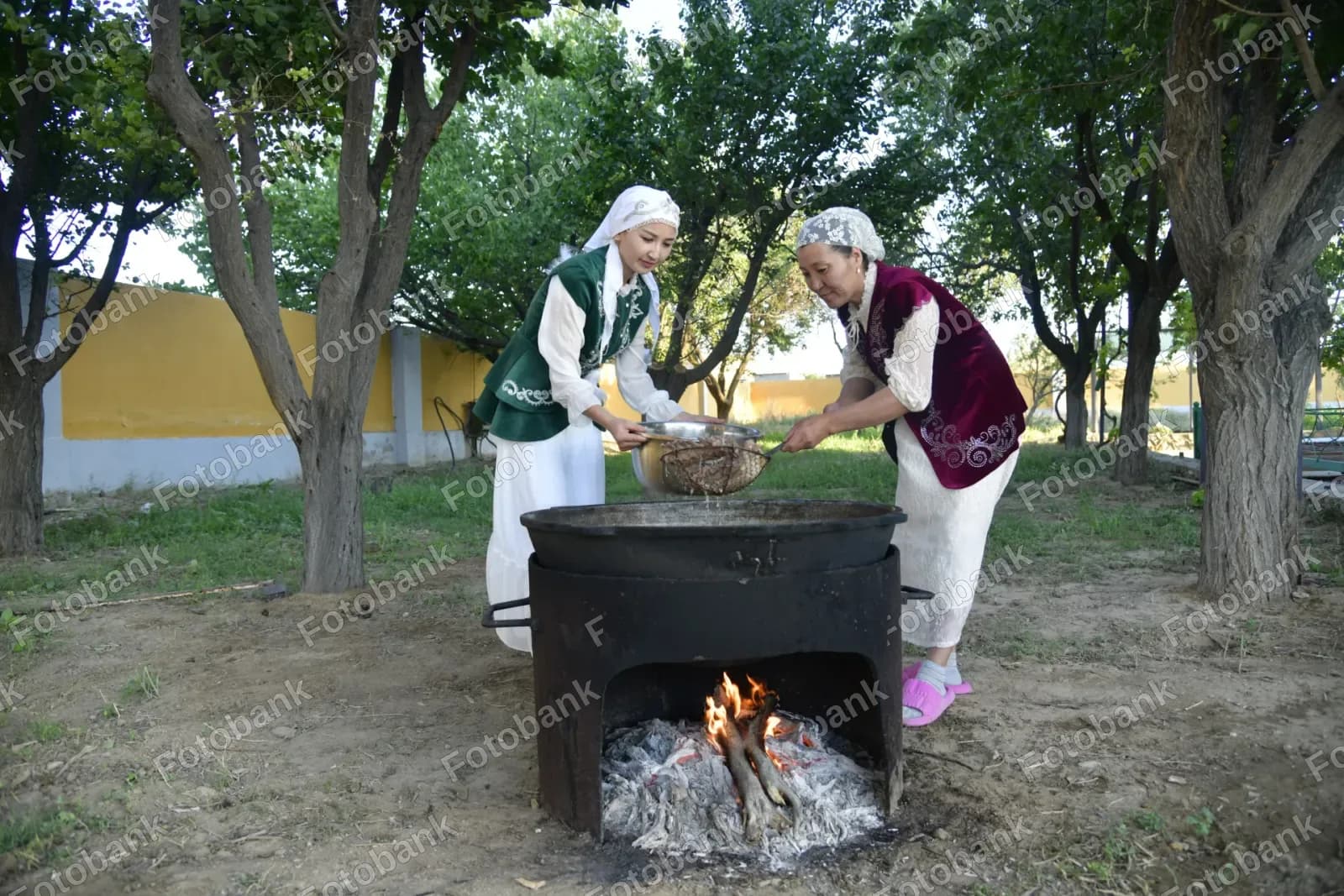 women cooking food in garden