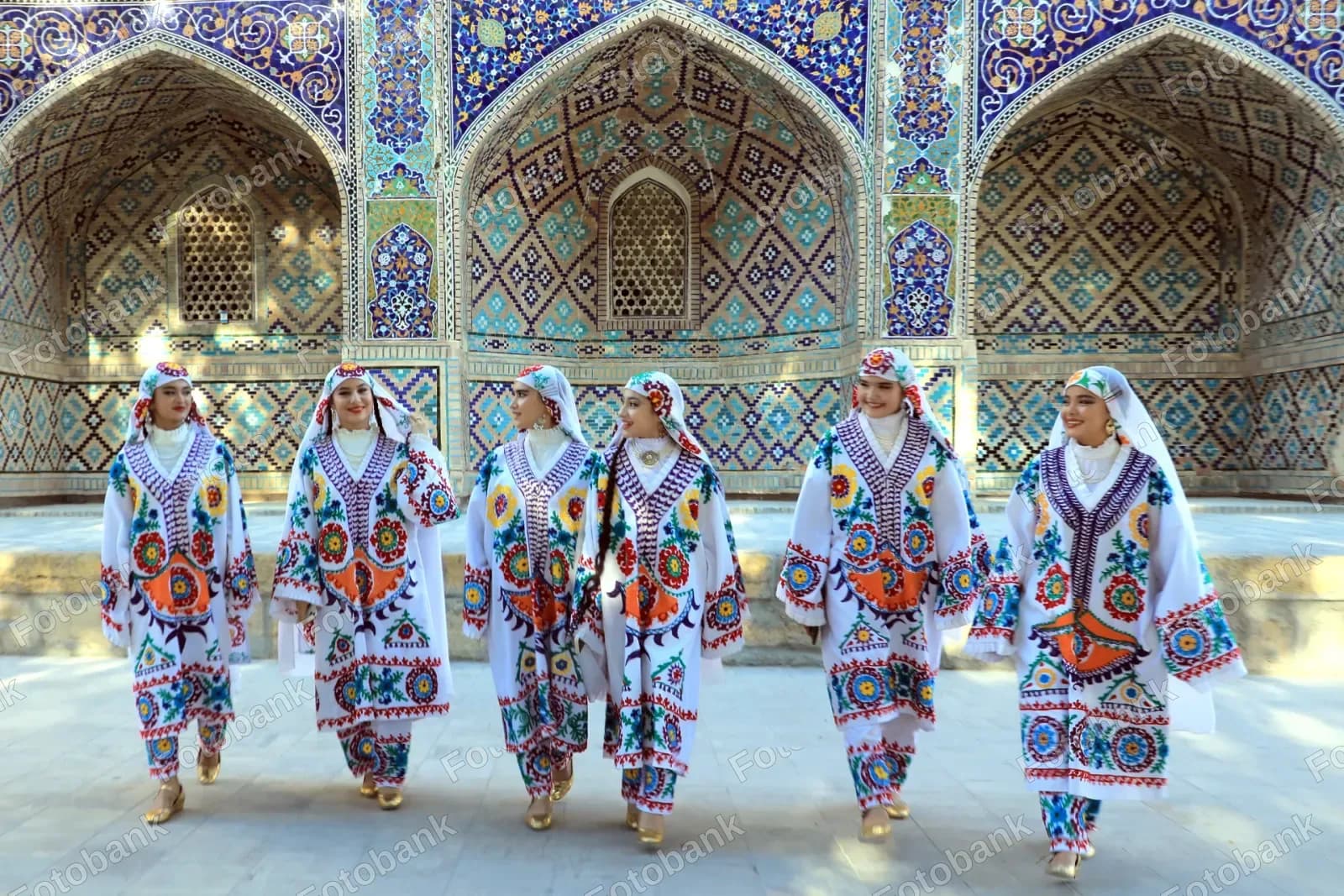 women wearing traditional embroidered clothing