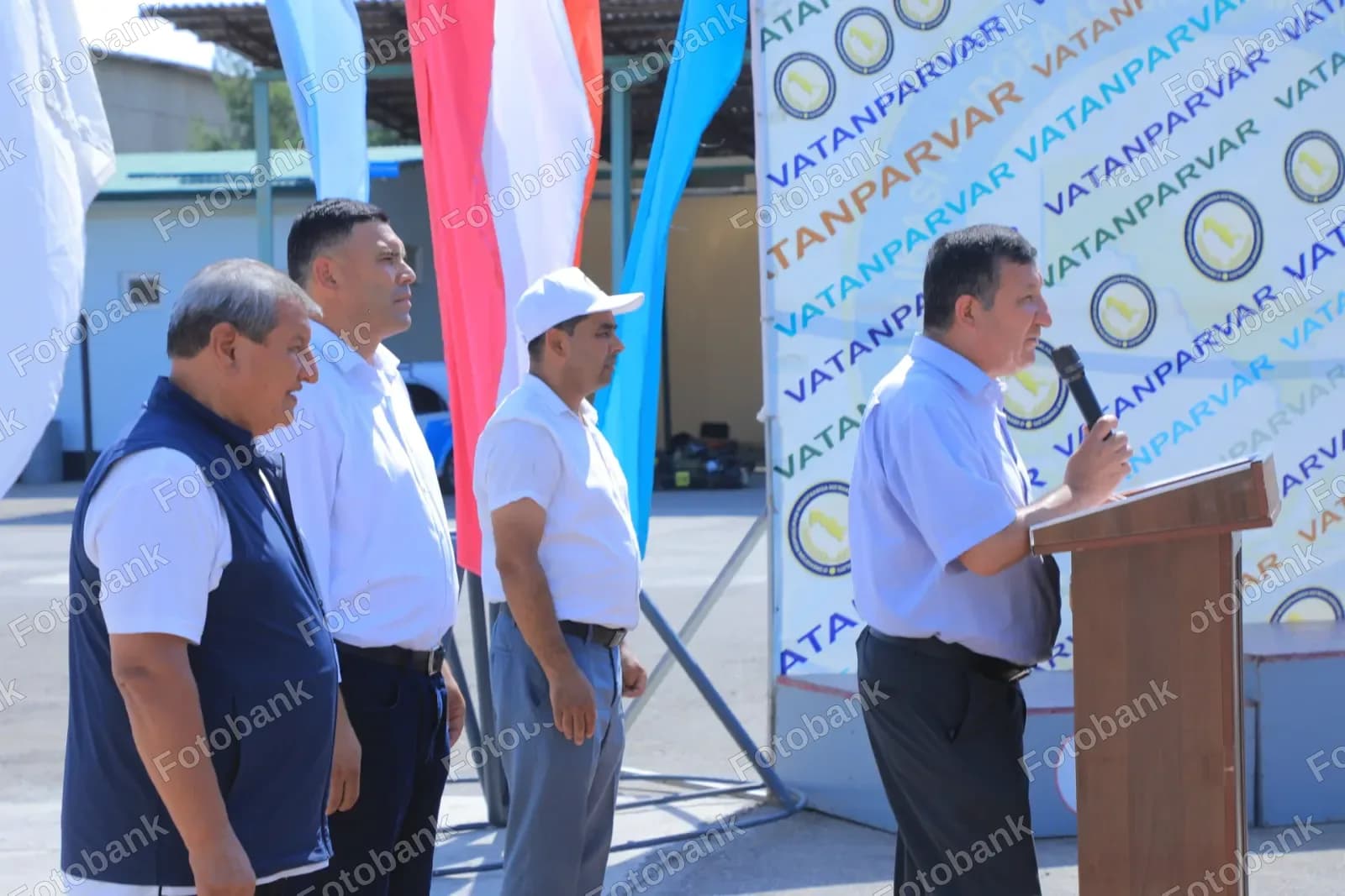 Man speaks at outdoor event