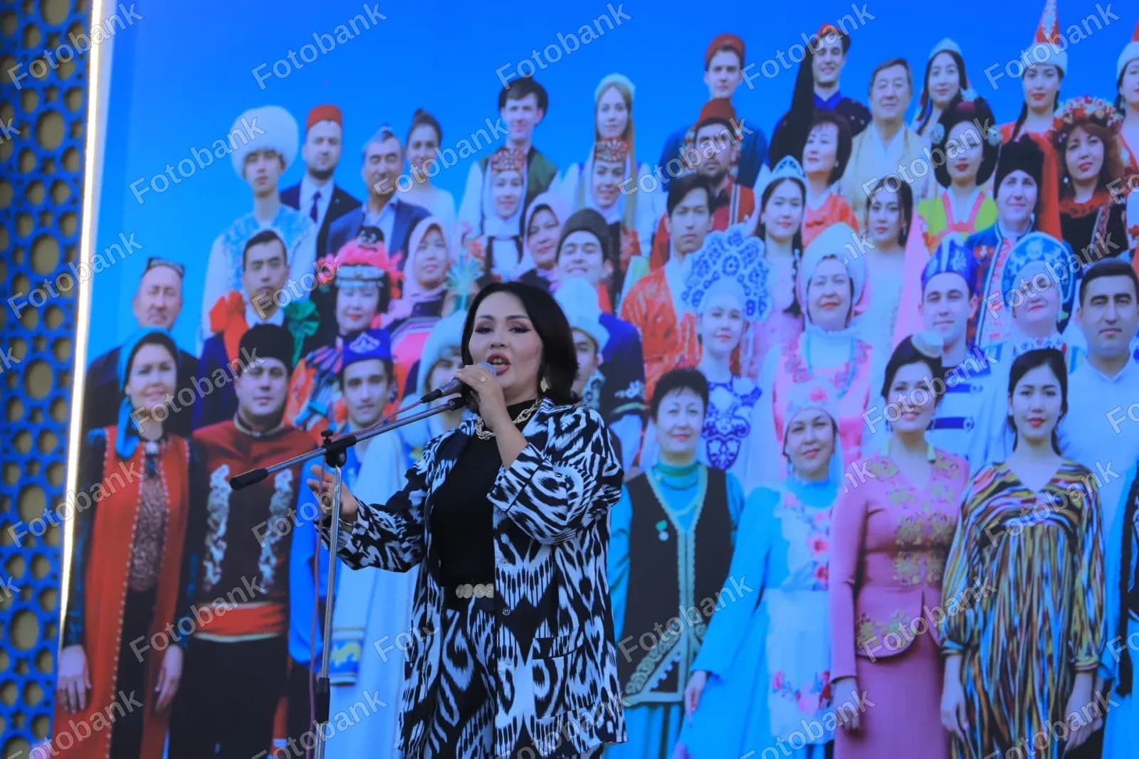 Woman performs on stage outdoors